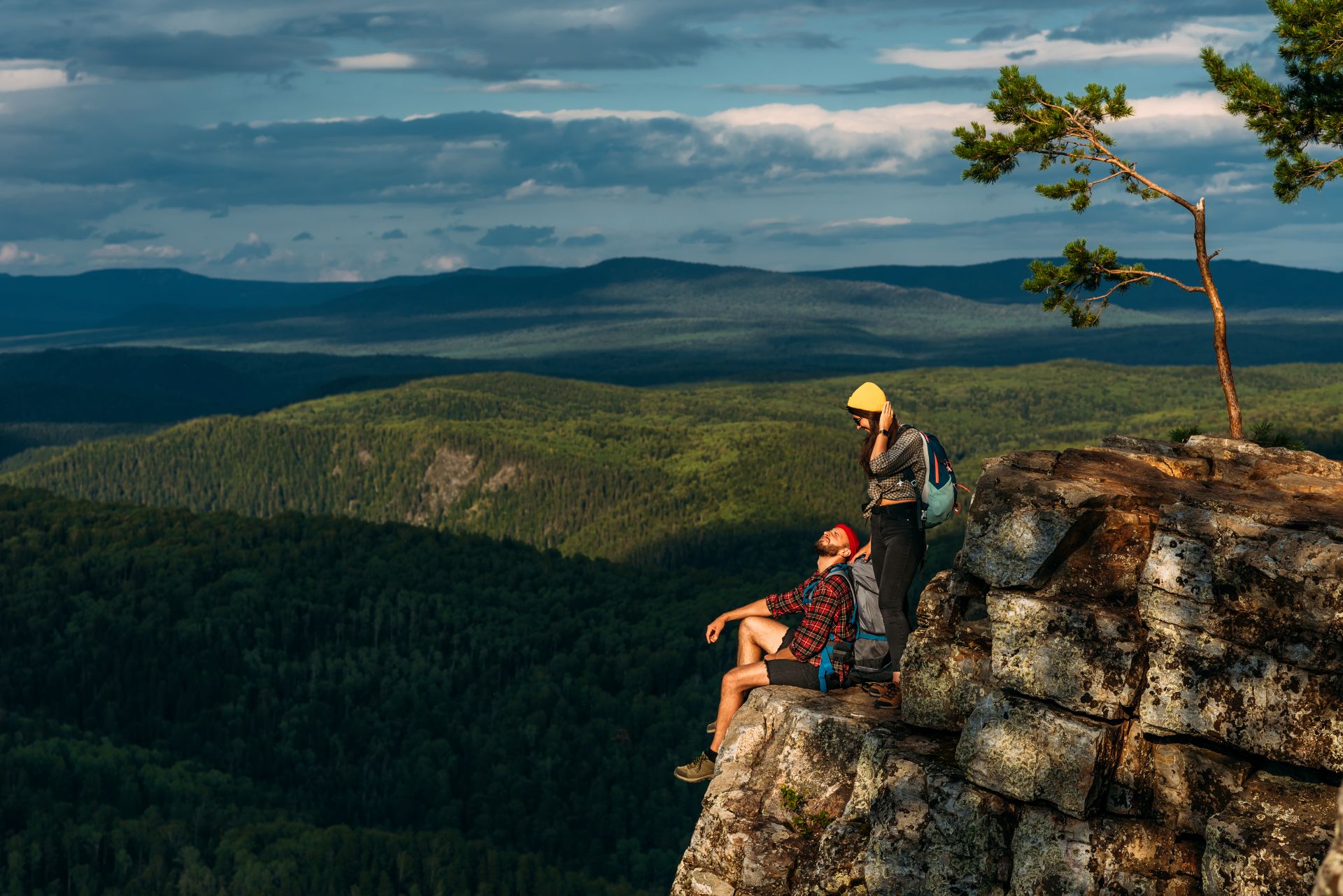 Hikers enjoying the view from a mountaintop.