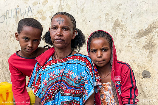 Tseqe Fiseha, 45, fled with her daughters Rahel and Kisanat after armed men stormed their house in the Central Zone of Ethiopia's Tigray region seven months ago. Her husband was out working on their farm in Humera and she has not heard from him since. She is now living in a secondary school in the regional capital Mekelle.
